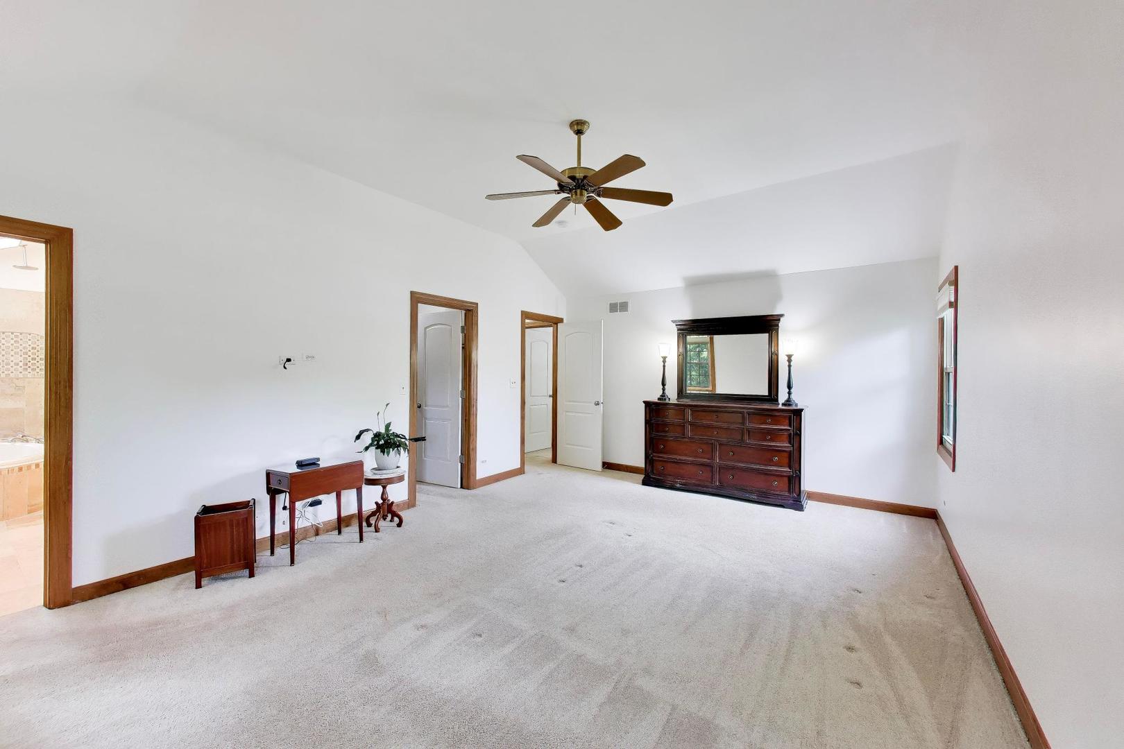 1528 Sequoia Road Naperville, IL 60540 - Photo 22 of 34 a big room with chandelier and furniture