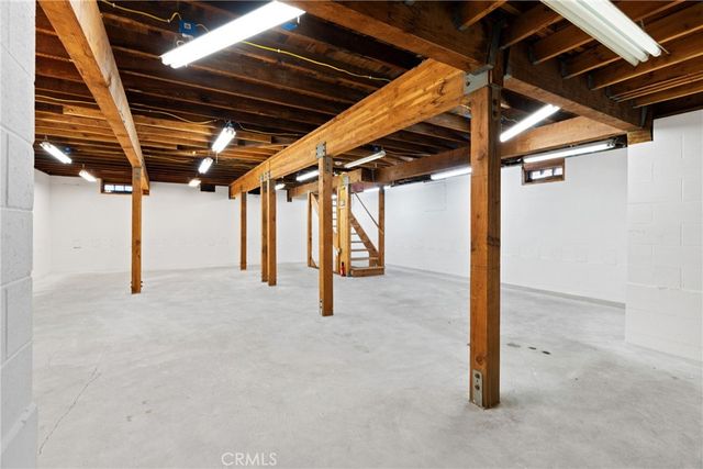 a bathroom with a sink a mirror and shower