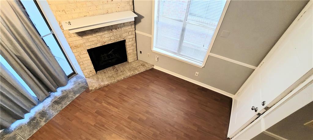 2500 Burleson Road, Unit 611 Austin, TX 78741 - Photo 3 of 22 a view of a livingroom with an empty space and a fireplace