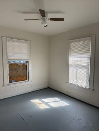 a bathroom with a sink toilet vanity and bathtub
