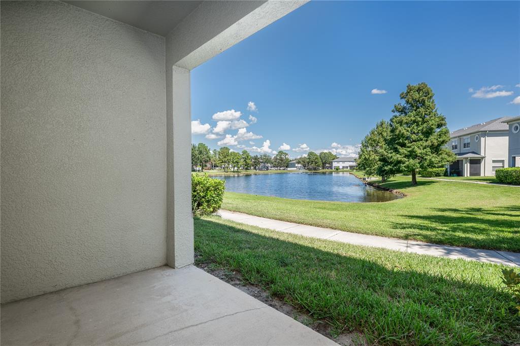 9441 Flowering Cottonwood Road, Unit 41 Orlando, FL 32832 - Photo 12 of 31 a view of a house with a yard