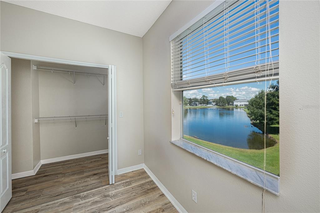 9441 Flowering Cottonwood Road, Unit 41 Orlando, FL 32832 - Photo 21 of 31 a view of a small space with wooden floor and a window