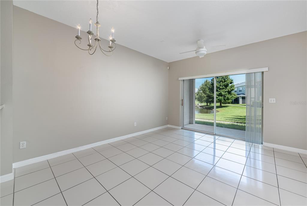 9441 Flowering Cottonwood Road, Unit 41 Orlando, FL 32832 - Photo 8 of 31 a view of an empty room with a window