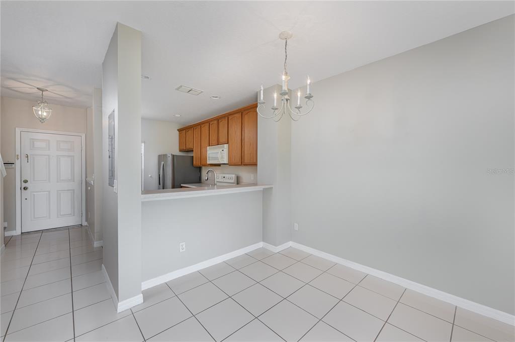 9441 Flowering Cottonwood Road, Unit 41 Orlando, FL 32832 - Photo 9 of 31 a view of a kitchen and window