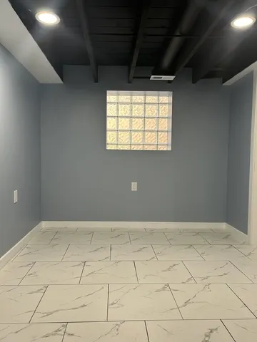 a bathroom with a toilet a sink and vanity