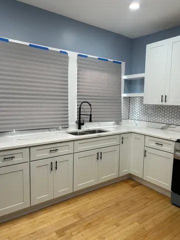 a kitchen with a sink and cabinets
