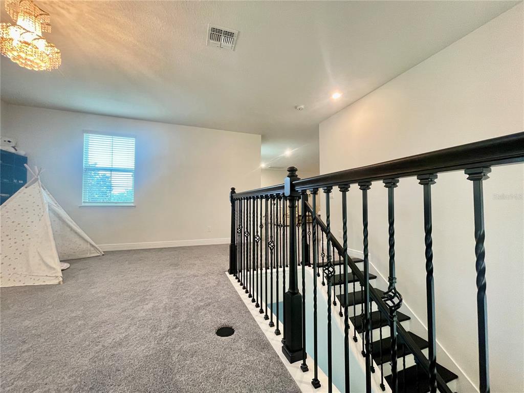 16611 Toccoa Row Winter Garden, FL 34787 - Photo 20 of 31 an entryway in a hall with a window