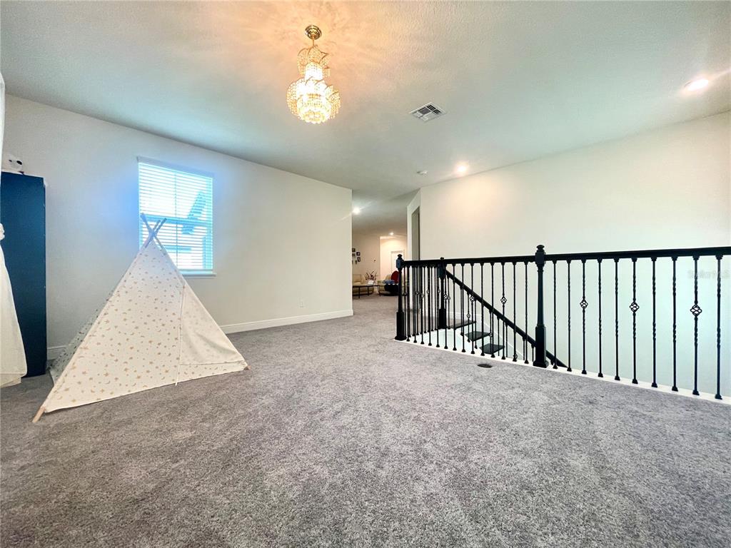 16611 Toccoa Row Winter Garden, FL 34787 - Photo 21 of 31 a view of a livingroom with a staircase