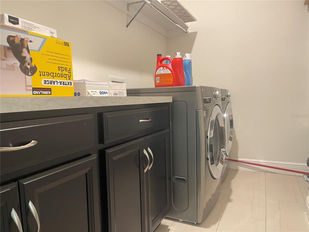16611 Toccoa Row Winter Garden, FL 34787 - Photo 30 of 31 a utility room with dryer and washer