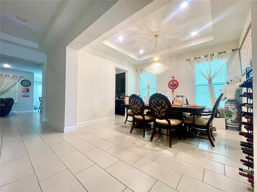 16611 Toccoa Row Winter Garden, FL 34787 - Photo 6 of 31 a group of people sitting in a room