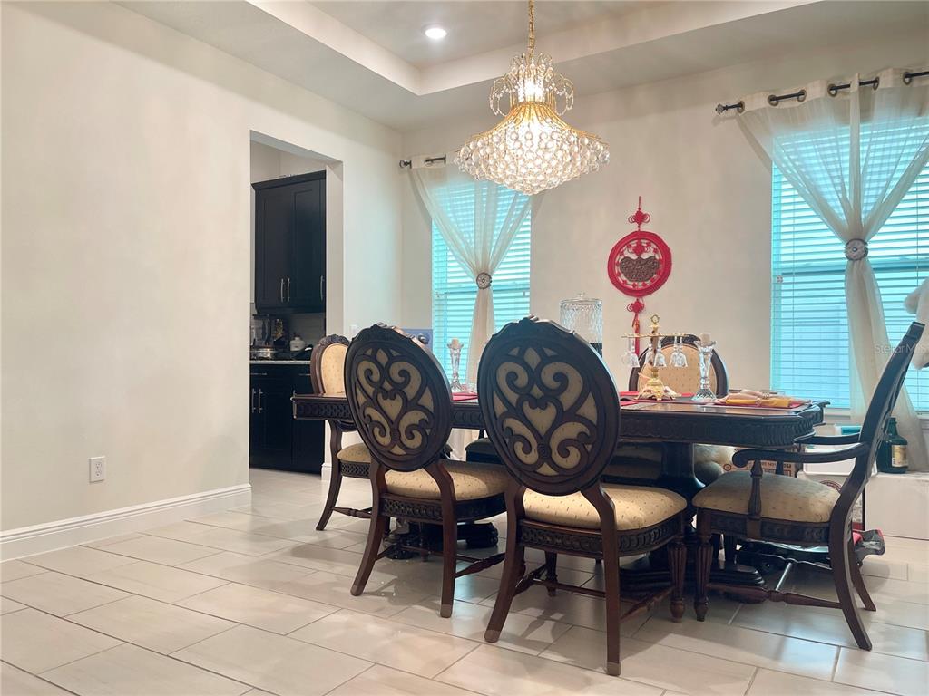 16611 Toccoa Row Winter Garden, FL 34787 - Photo 7 of 31 a view of a dining room with furniture