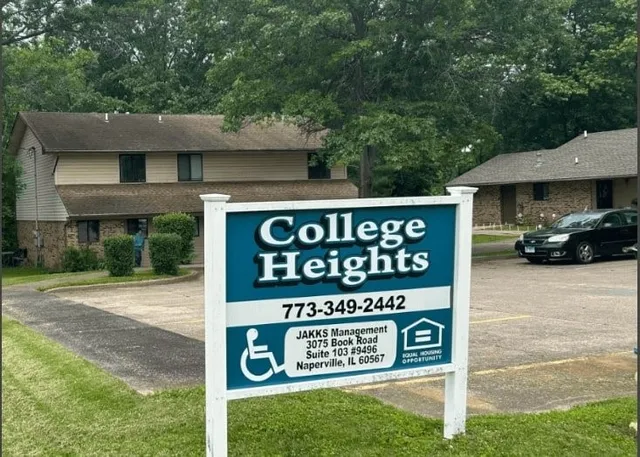 a view of sign board with a yard