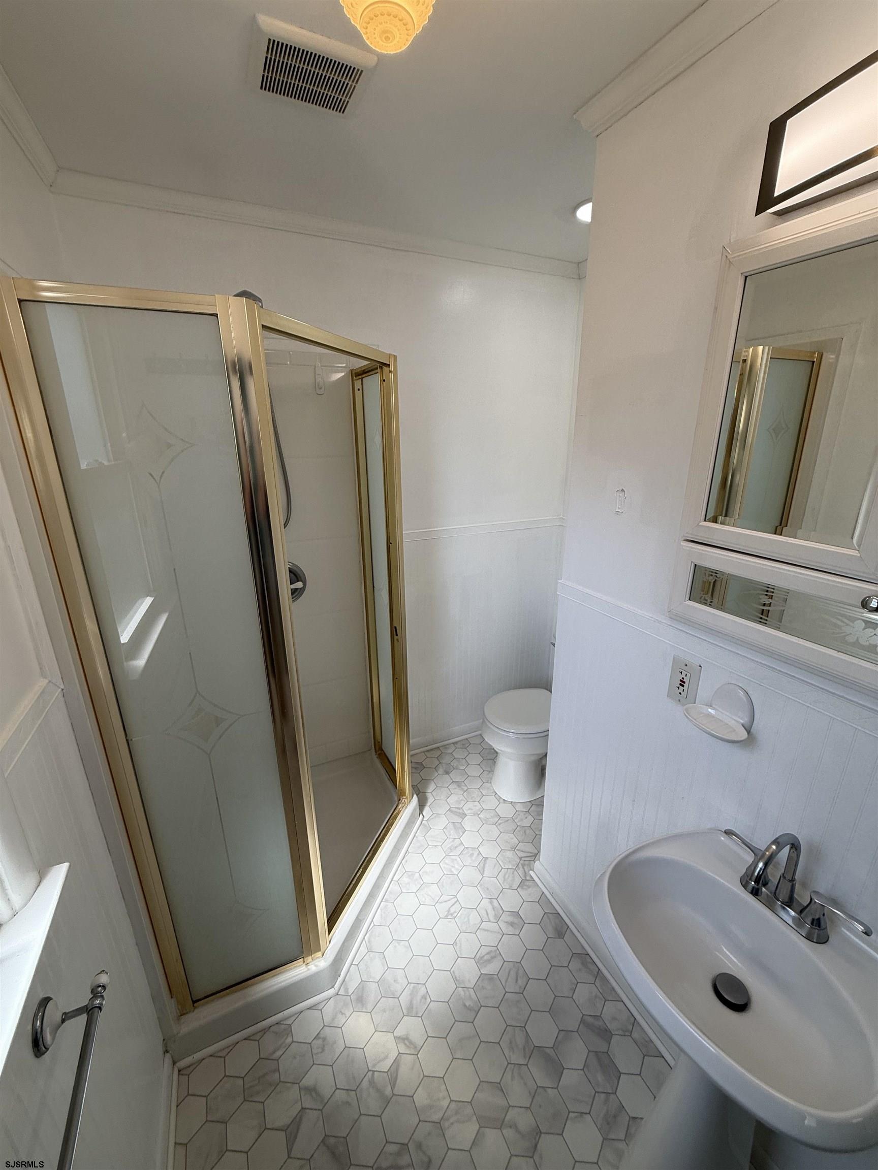 230 Bethel Road Somers Point, NJ 08244 - Photo 12 of 30 a bathroom with mirror sink and toilet