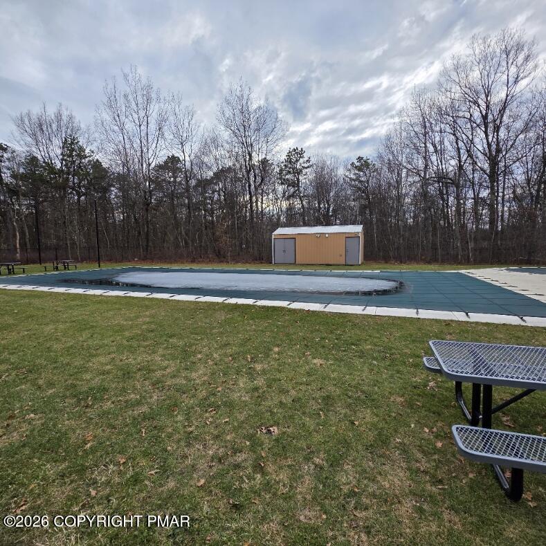 Snowy Ridge Jim Thorpe, PA 18229 - Photo 32 of 40 a view of a swimming pool with an outdoor space and seating area