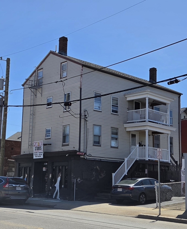155 Rodman Street Fall River, MA 02721 - Photo 2 of 32 a car parked in front of a building
