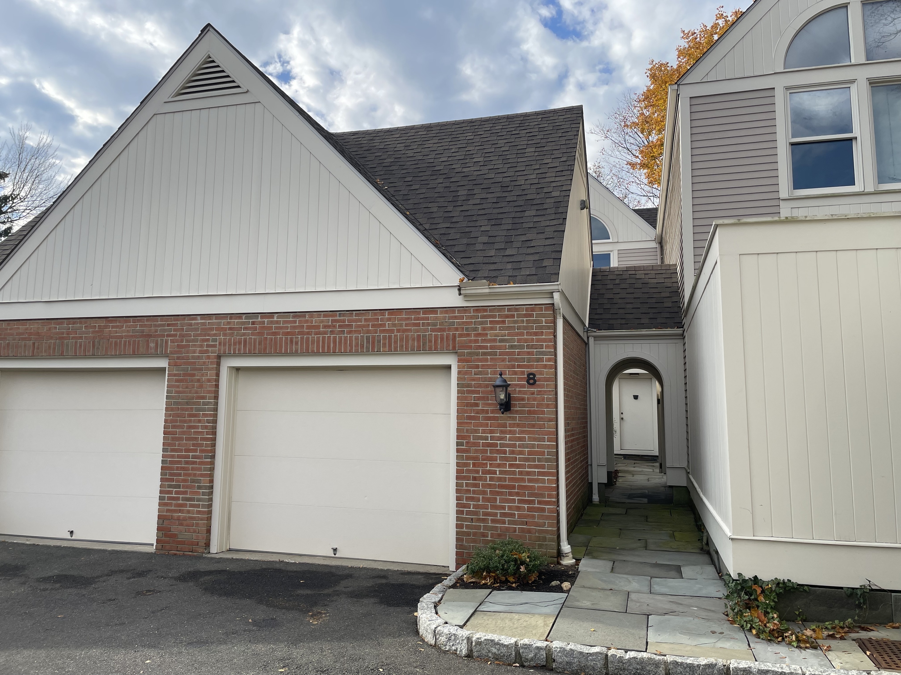 a front view of a house with a garage