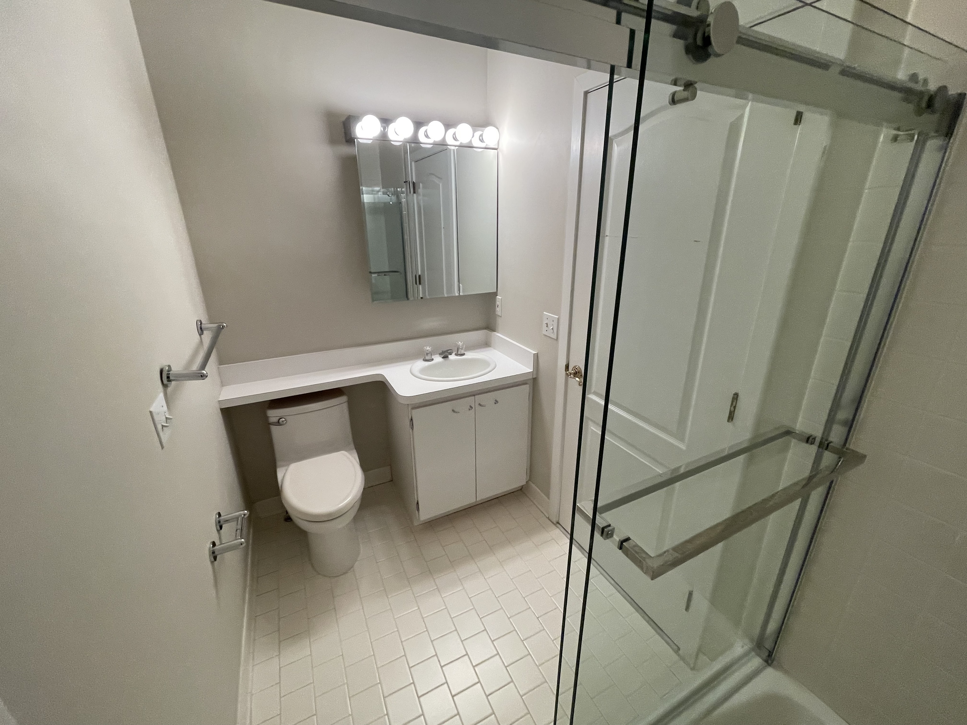 8 Sedgewick Village Lane Darien, CT 06820 - Photo 13 of 15 a bathroom with a toilet a sink a mirror and vanity