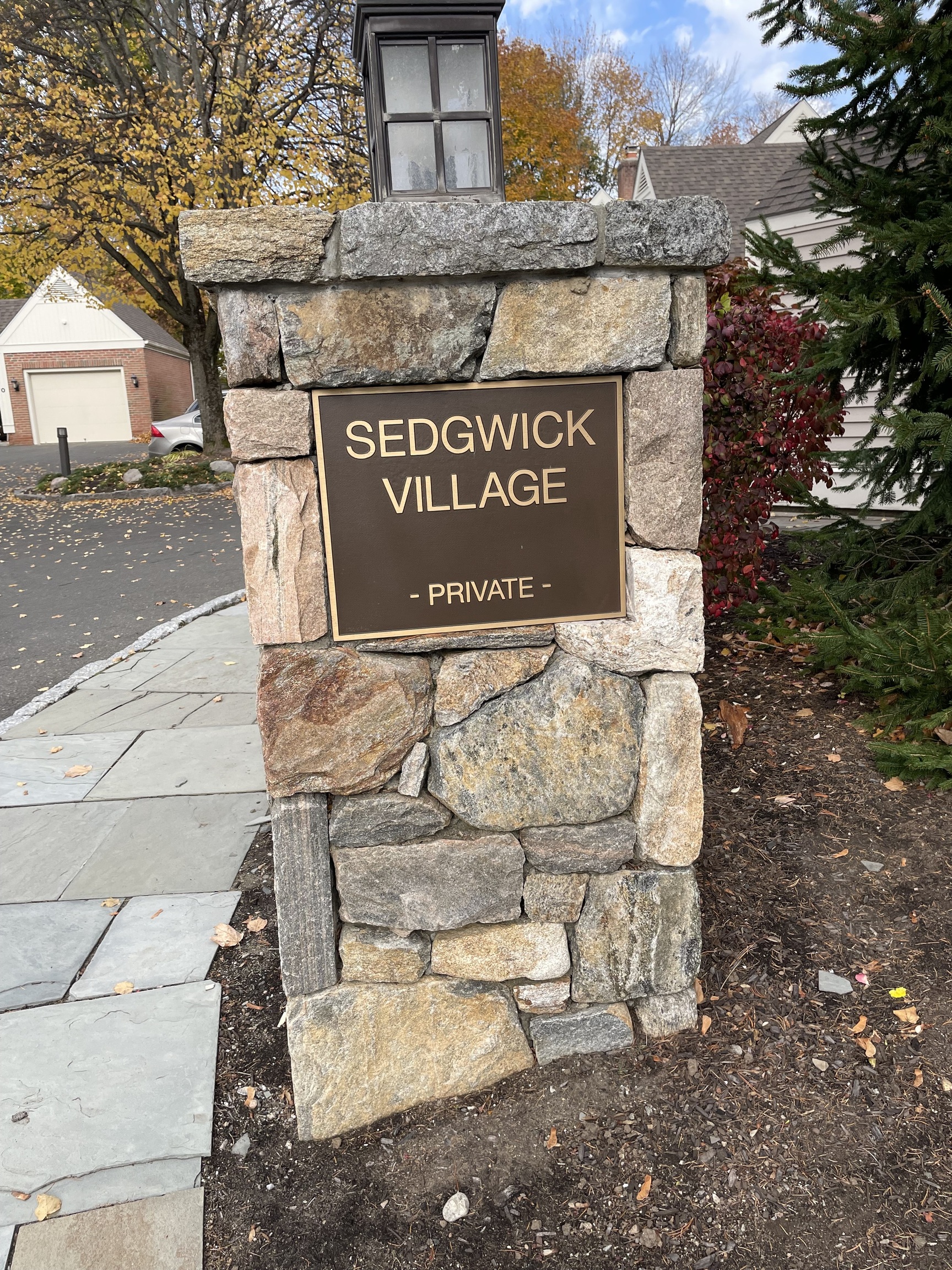 8 Sedgewick Village Lane Darien, CT 06820 - Photo 15 of 15 a view of a street with benches and trees