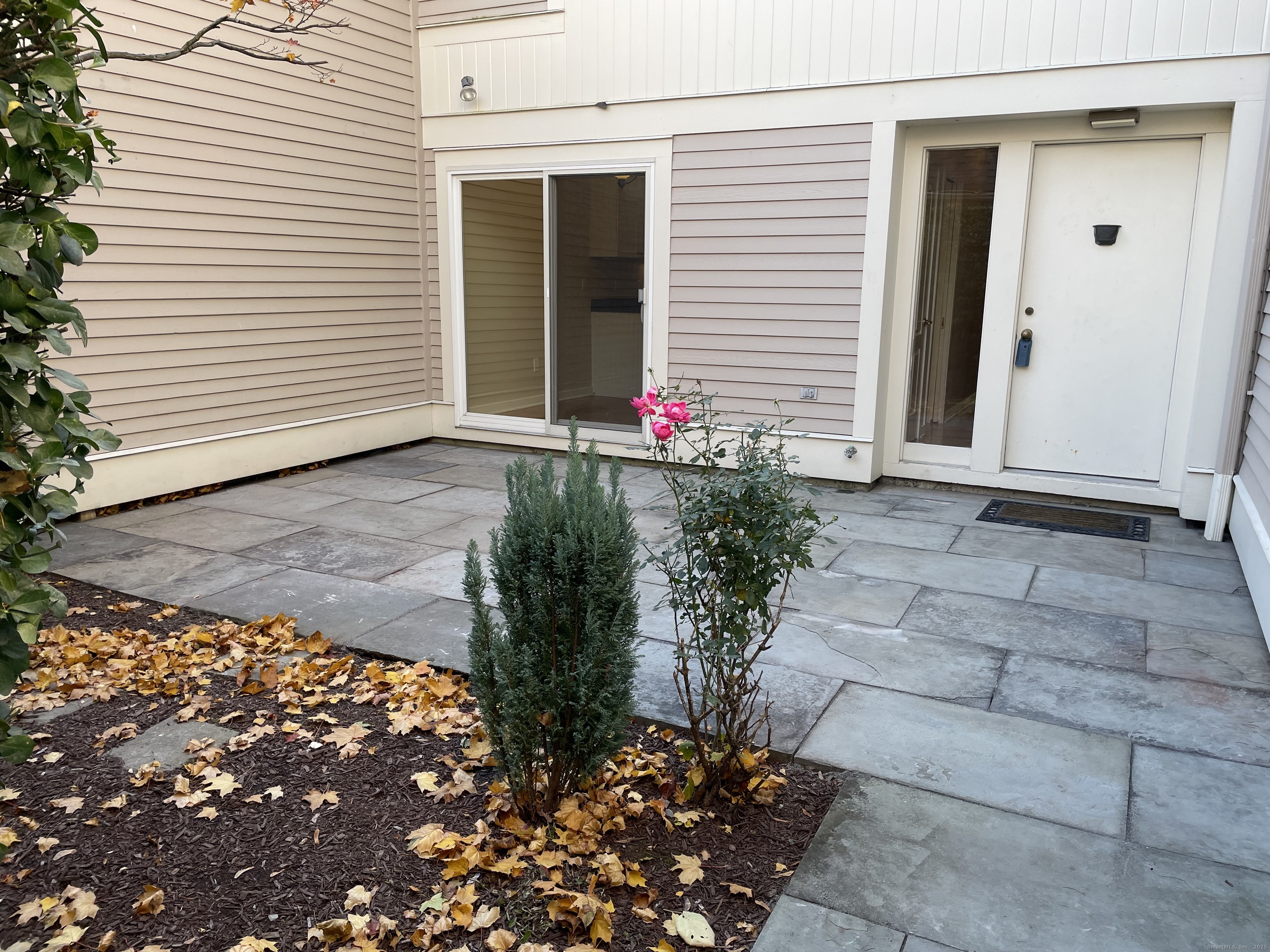 8 Sedgewick Village Lane Darien, CT 06820 - Photo 2 of 15 a front view of a house with a garage