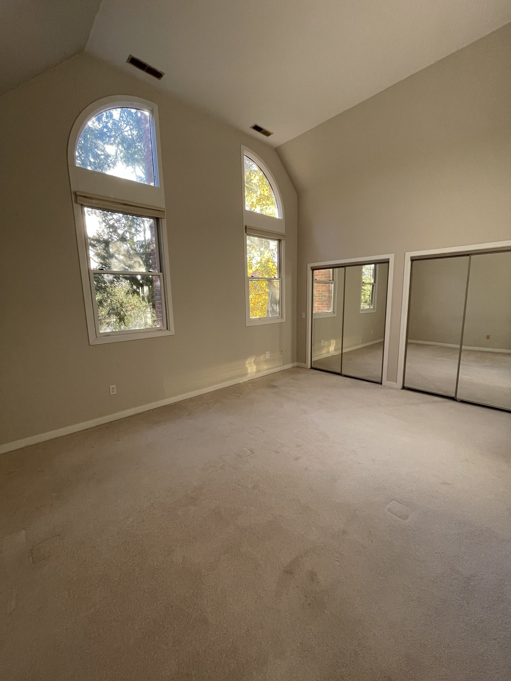 8 Sedgewick Village Lane Darien, CT 06820 - Photo 10 of 15 an empty room with windows and mirror