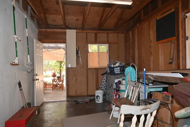a view of a hallway with seating area