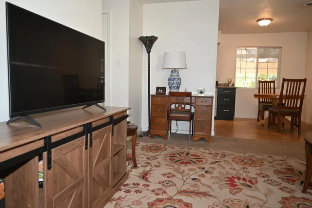 a view of a livingroom with furniture and window