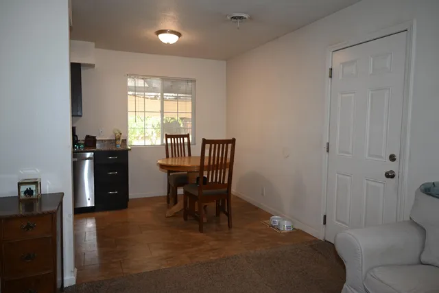 a bedroom with a bed and a table in it