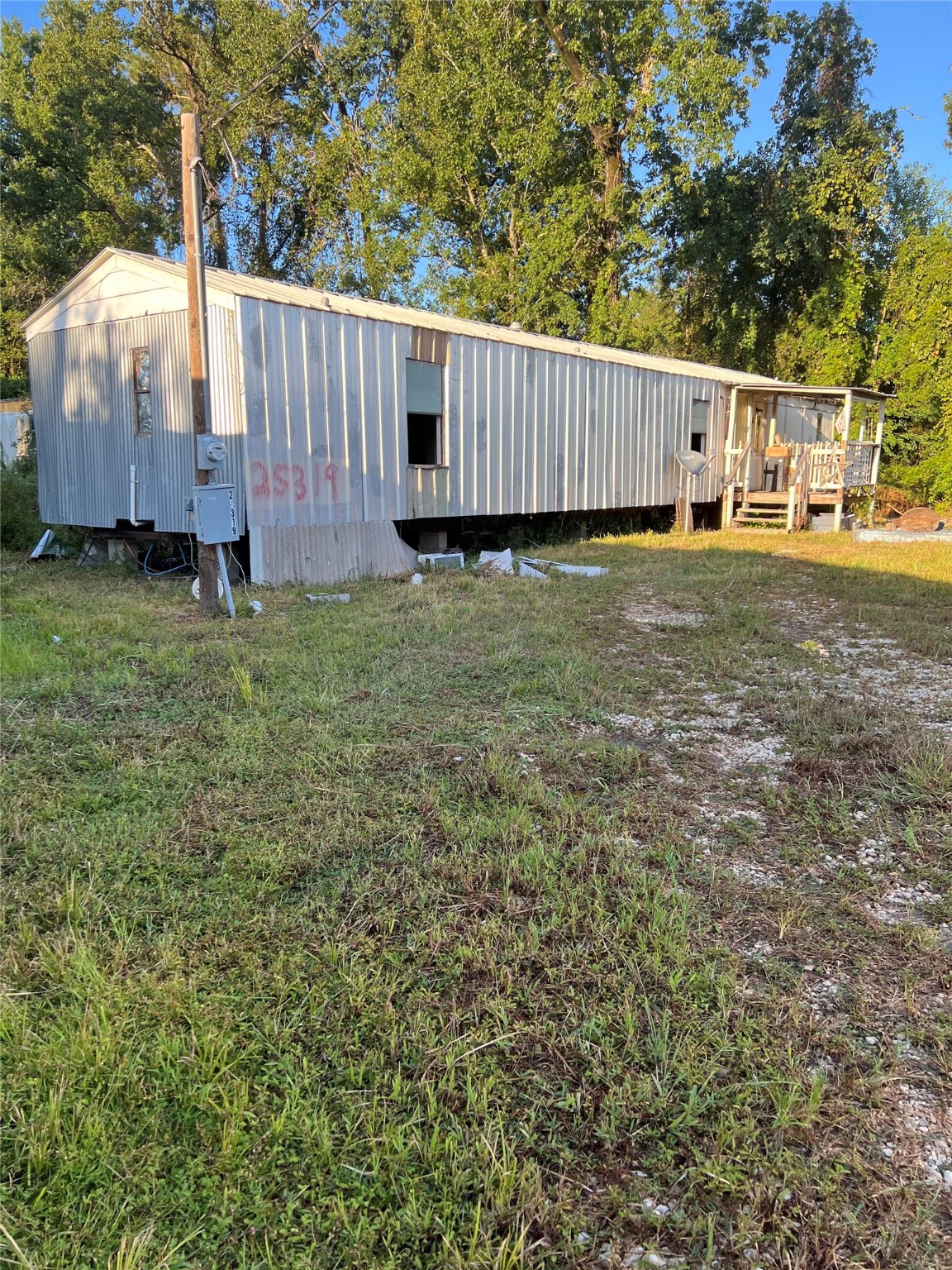 25303 Colette Street Porter, TX 77365 - Photo 12 of 12 a view of a house with a yard and wooden fence