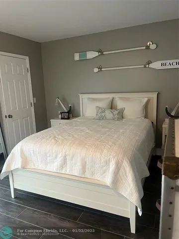 a large white bed in a small room