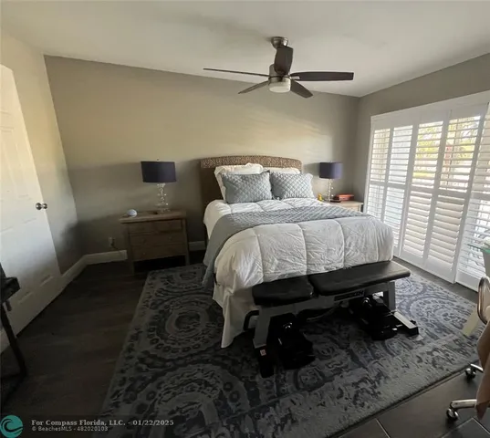 a bed room with a bed and a window