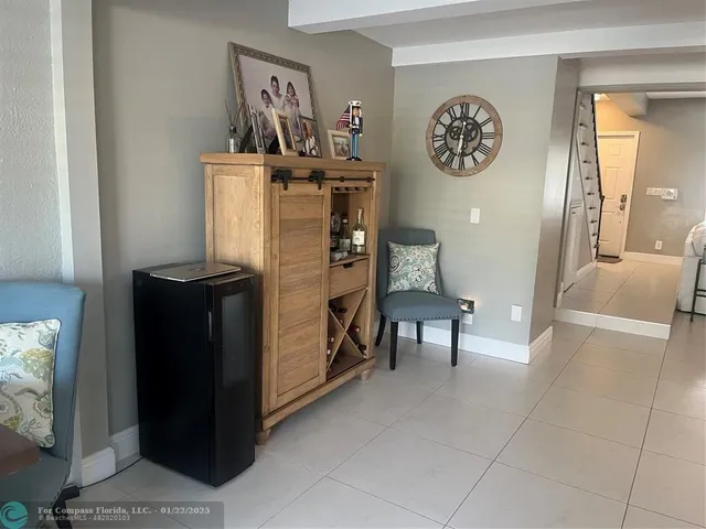 a view of a hallway with seating area