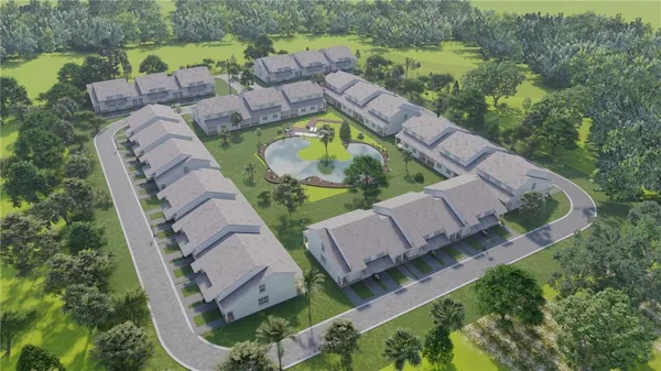an aerial view of a house with outdoor space and a lake view