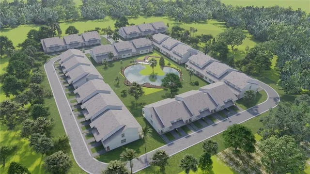 an aerial view of a house with outdoor space and a lake view