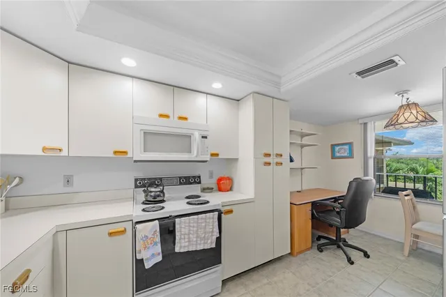 a kitchen with stainless steel appliances a stove a sink and a refrigerator