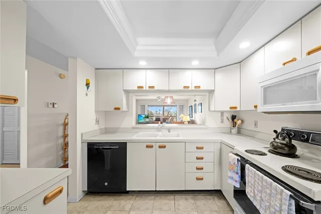 a kitchen with a stove top oven and cabinets