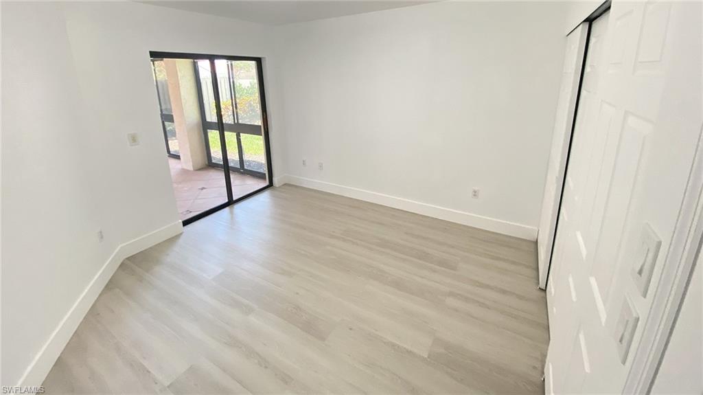 718 Reef Point Circle Naples, FL 34108 - Photo 16 of 23 an empty room with windows