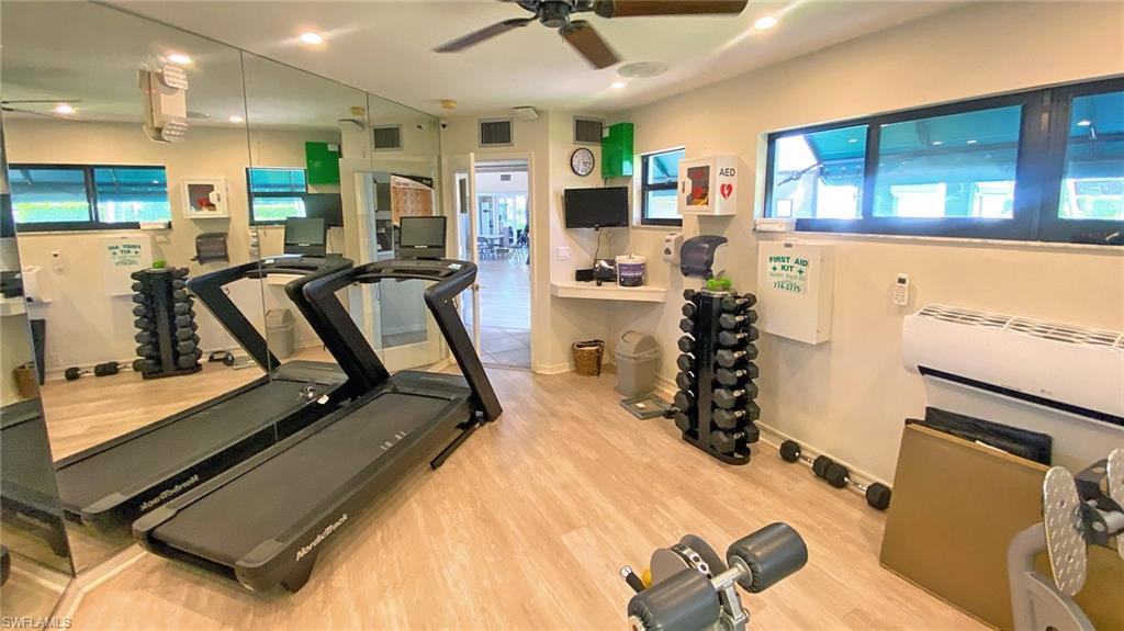 718 Reef Point Circle Naples, FL 34108 - Photo 20 of 23 a view of a room with gym equipment