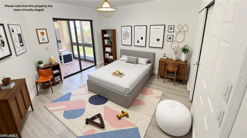 718 Reef Point Circle Naples, FL 34108 - Photo 7 of 23 a living room with furniture and wooden floor