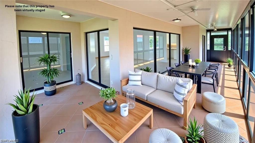718 Reef Point Circle Naples, FL 34108 - Photo 8 of 23 a living room with furniture potted plant and a large window