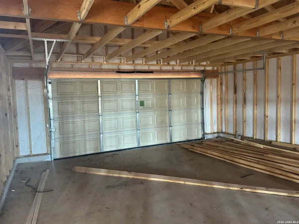 a view of a room with wooden walls