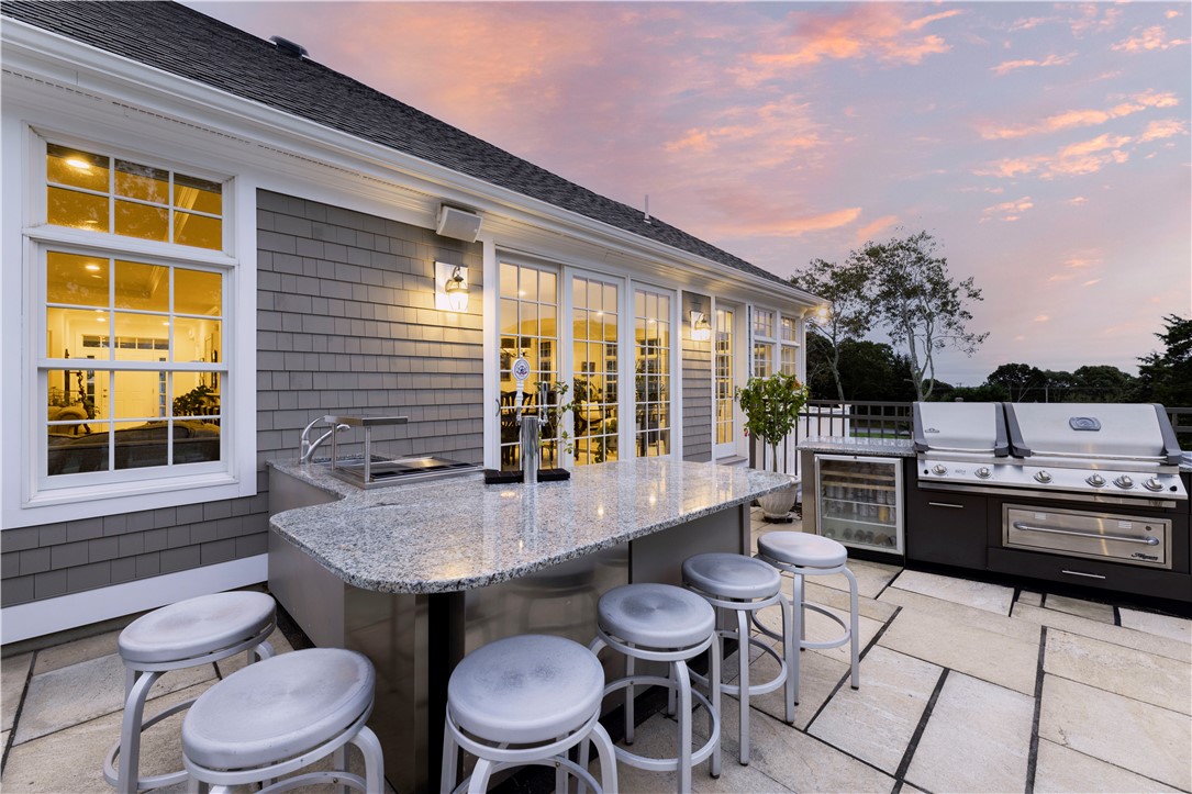 2 Kettle Cl Westerly, RI 02891 - Photo 37 of 49 Outdoor kitchen at twilight