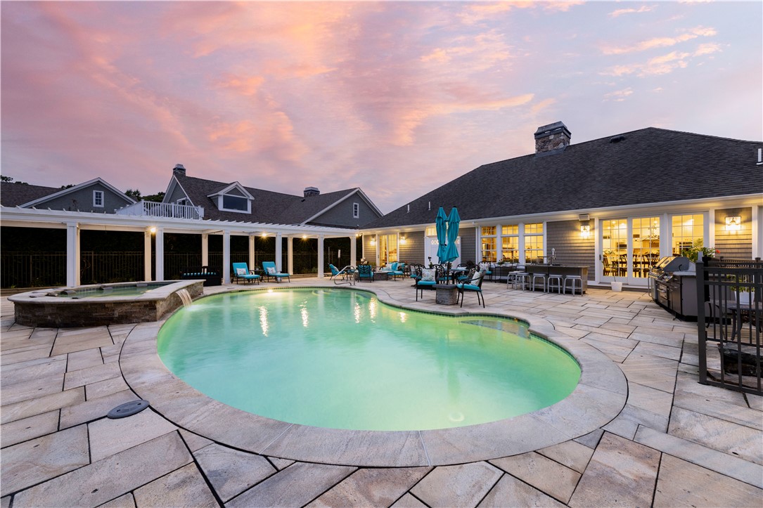 2 Kettle Cl Westerly, RI 02891 - Photo 38 of 49 Rear patio/pool/spa area at twilight