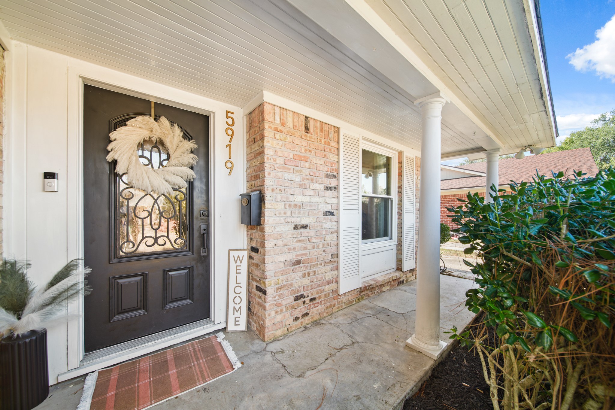 5919 Lattimer Drive Houston, TX 77035 - Photo 3 of 29 This welcoming front entrance features a charming covered porch with classic curb appeal.