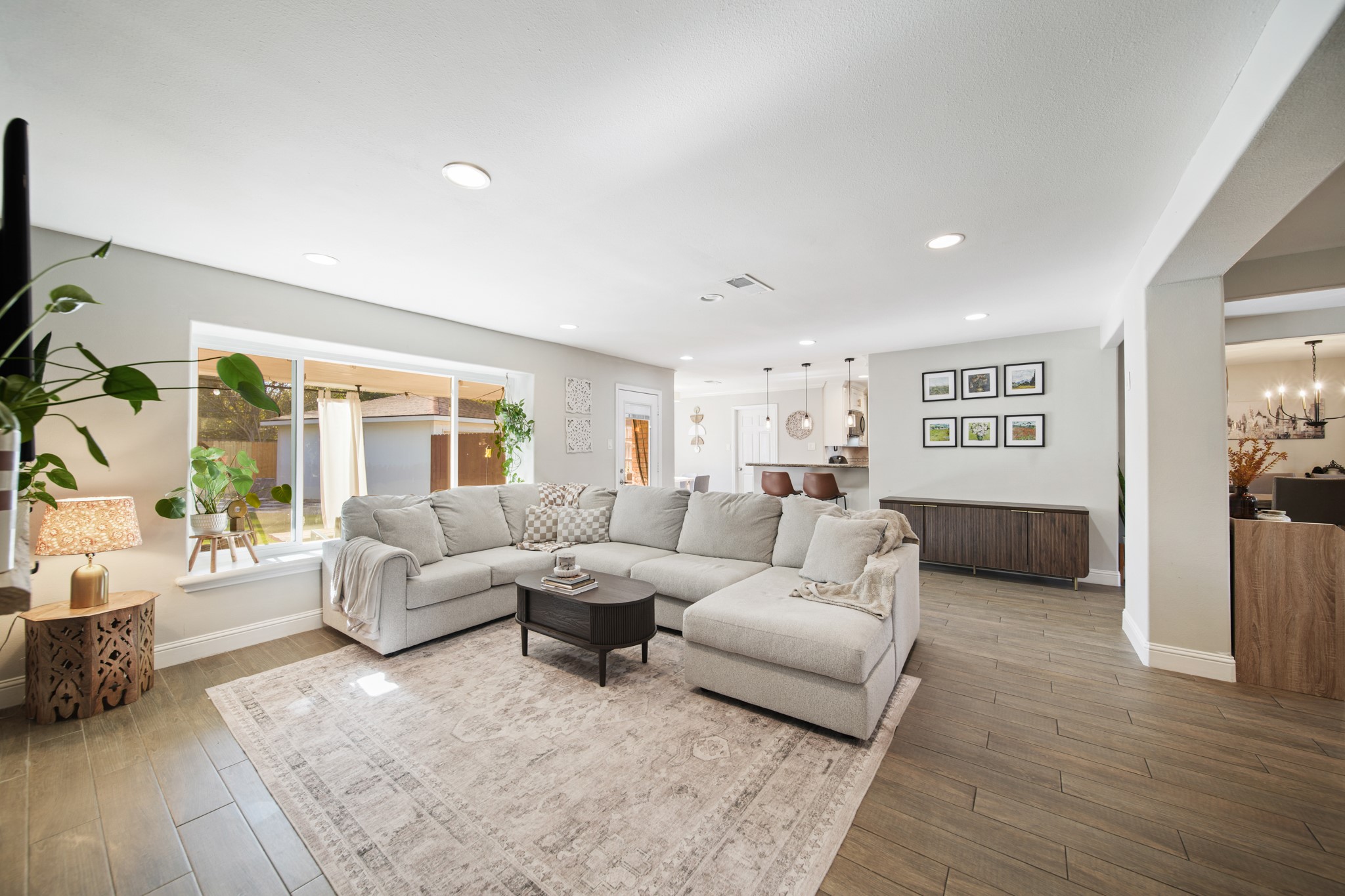 5919 Lattimer Drive Houston, TX 77035 - Photo 10 of 29 Large glass doors and windows allow natural light to pour in and offer easy access to the backyard.