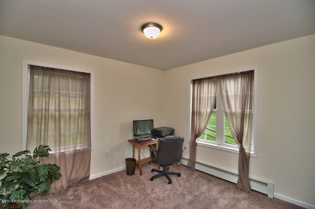 2430 Lower Demunds Road Dallas, PA 18612 - Photo 54 of 63 a view of a workspace with furniture and a window