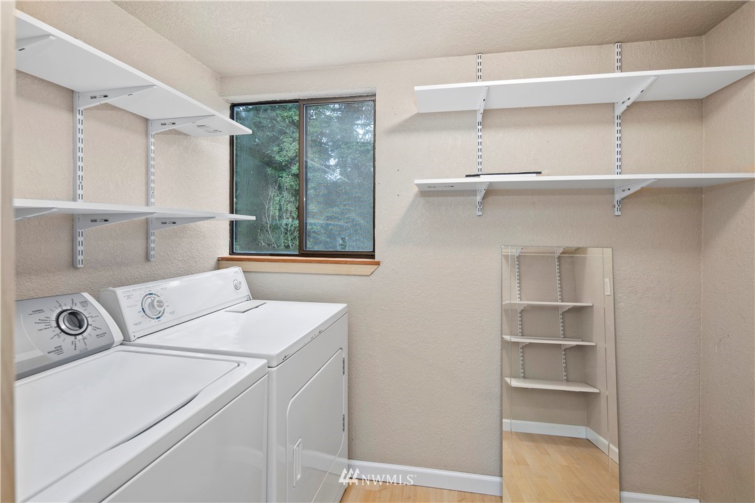 14401 Southeast Petrovitsky Road, Unit B204 Renton, WA 98058 - Photo 13 of 31 a utility room with dryer and washer