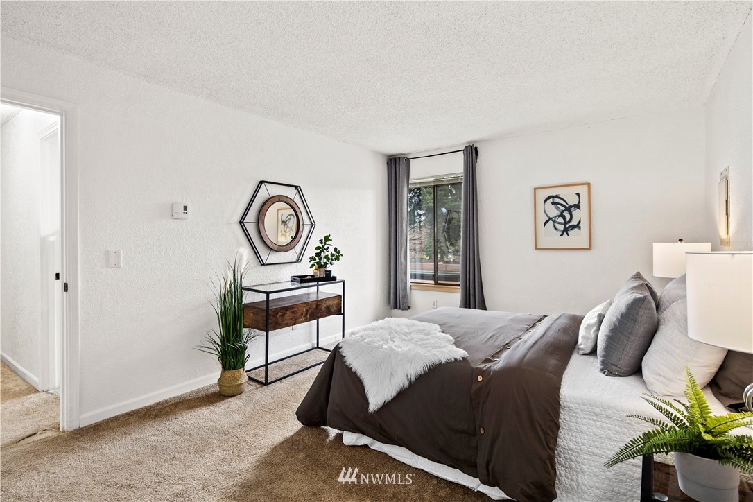 14401 Southeast Petrovitsky Road, Unit B204 Renton, WA 98058 - Photo 17 of 31 a living room with furniture a rug and a window