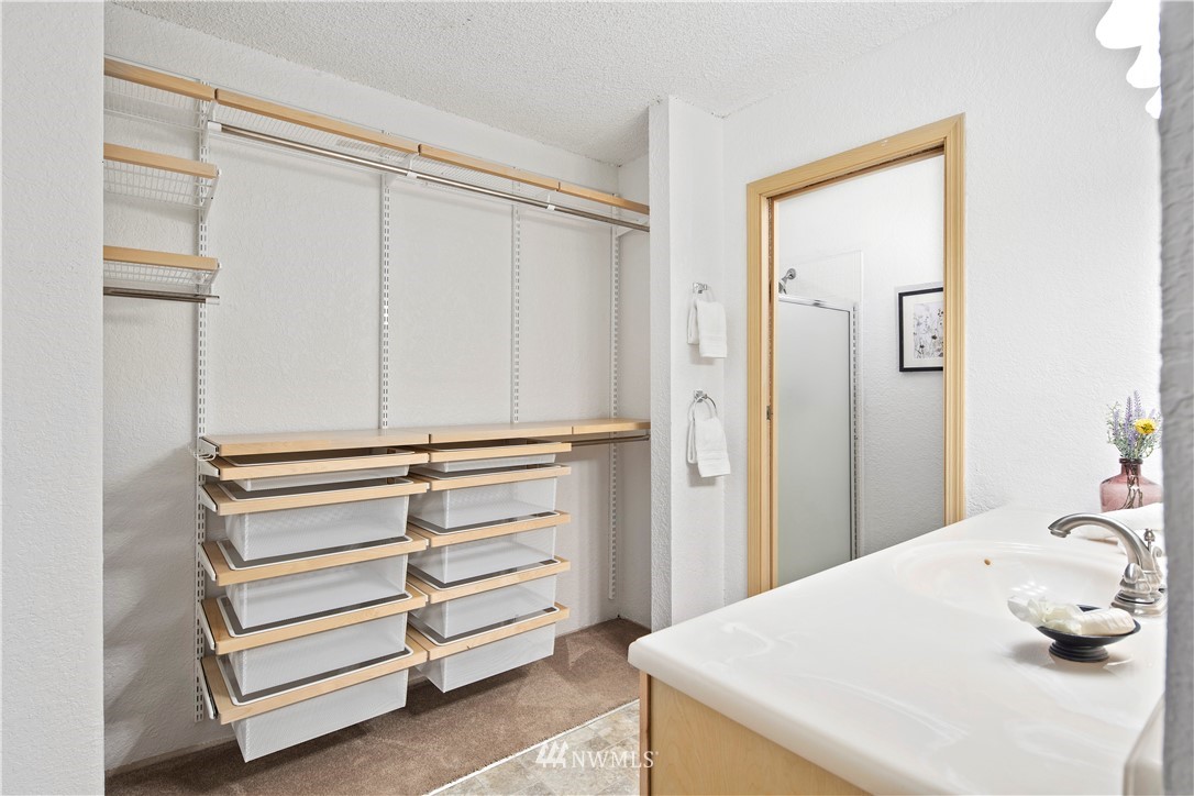 14401 Southeast Petrovitsky Road, Unit B204 Renton, WA 98058 - Photo 18 of 31 a bathroom with a sink and a mirror