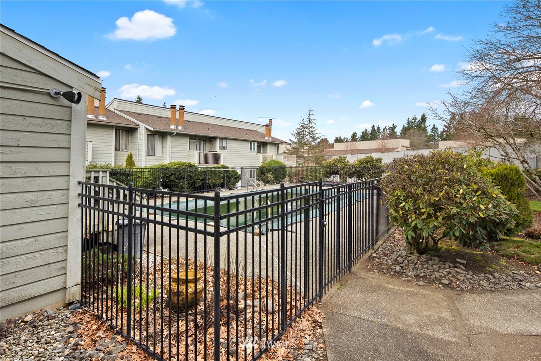 14401 Southeast Petrovitsky Road, Unit B204 Renton, WA 98058 - Photo 25 of 31 a front view of a house with a yard