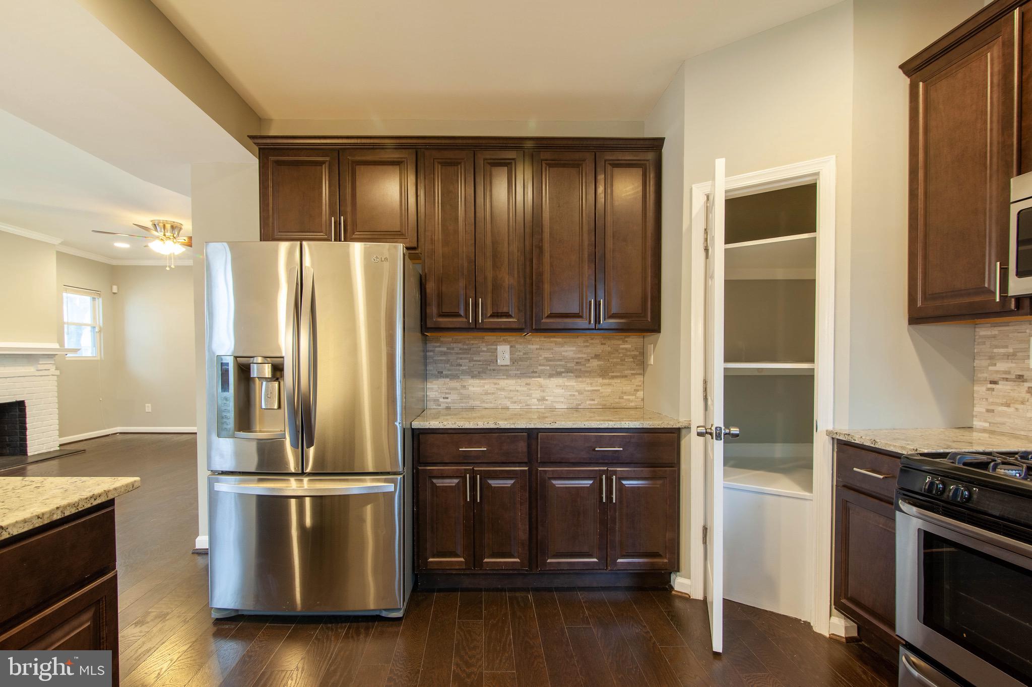 3409 Grantley Road Baltimore, MD 21215 - Photo 16 of 41 Kitchen View of Pantry and Fridge